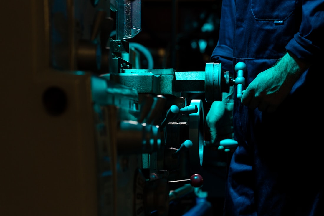 Machinist working at a production machine